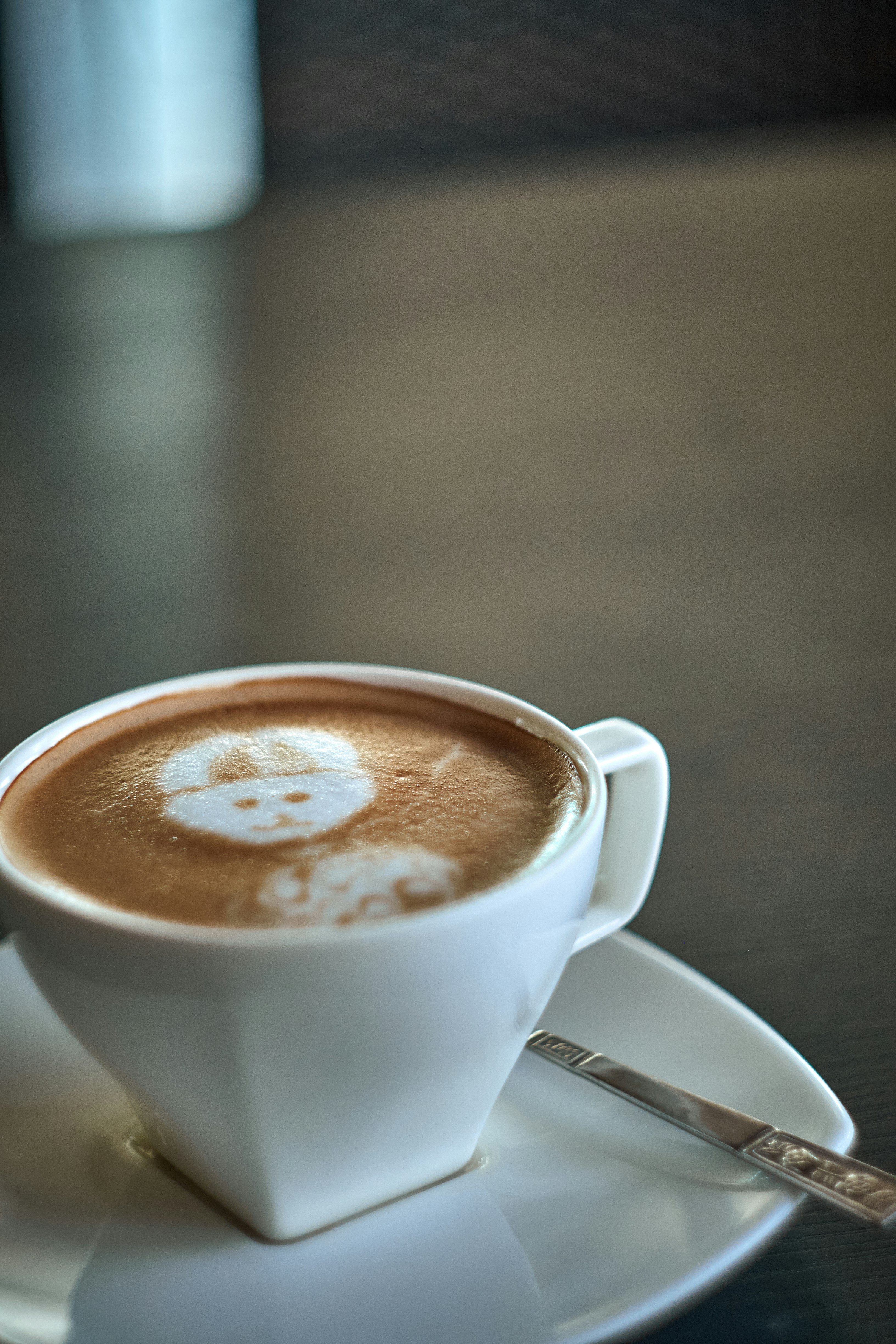 white ceramic mug with coffee